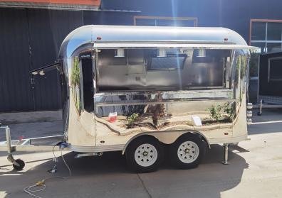 Compact stainless coffee trailer with service window