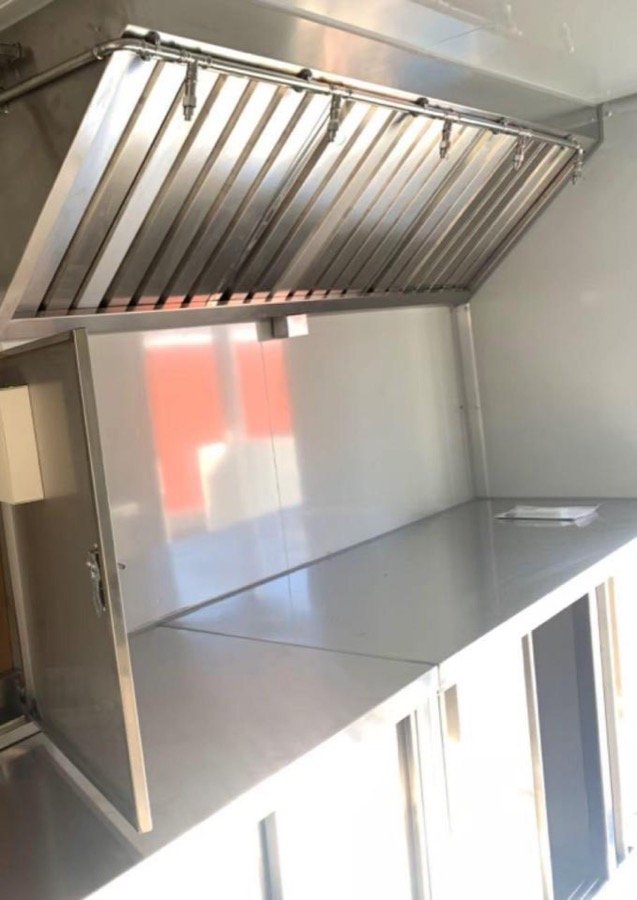 Stainless exhaust hood over the cooking line and counters