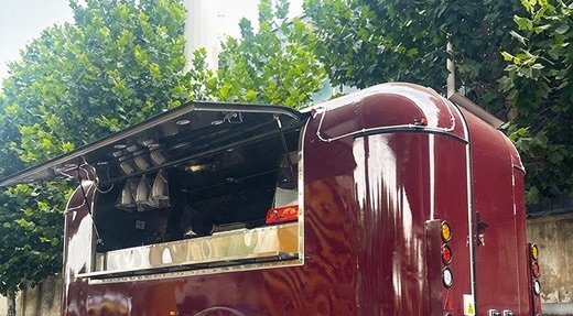 Trailer with a painted exterior and service window open