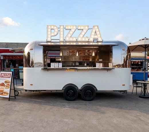 Mirror-finish stainless food trailer with a large service window